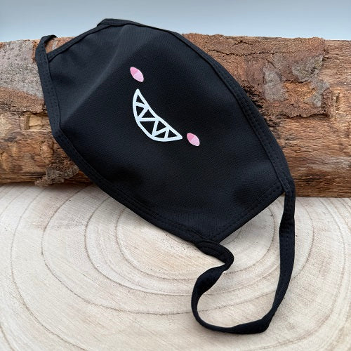 black-face-mask-with-a-comic-grin