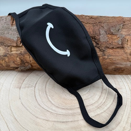 a-black-face-mask-with-a-smile-for-halloween