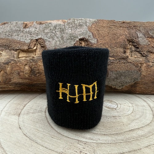 sweatband-wristband-in-black-with-band-him-logo-in-yellow